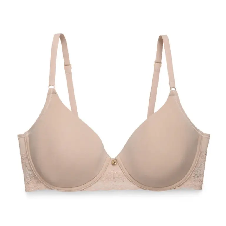 Nude bra: Light beige underwire bra with molded cups, lace side panels, adjustable straps, and a small gold charm at the center front.