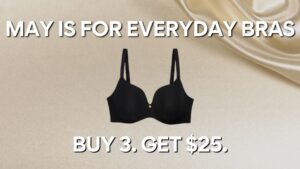 Promotional graphic with a smooth beige satin background, featuring a black everyday bra centered between bold white text that reads "MAY IS FOR EVERYDAY BRAS" at the top and "BUY 3. GET $25." at the bottom.