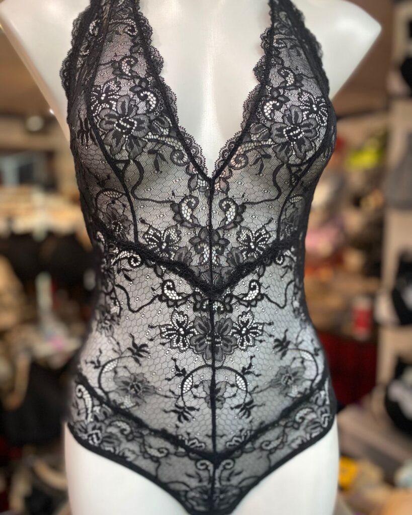 Black lace boudoir bodysuit displayed on a mannequin at Althea’s Fine Lingerie