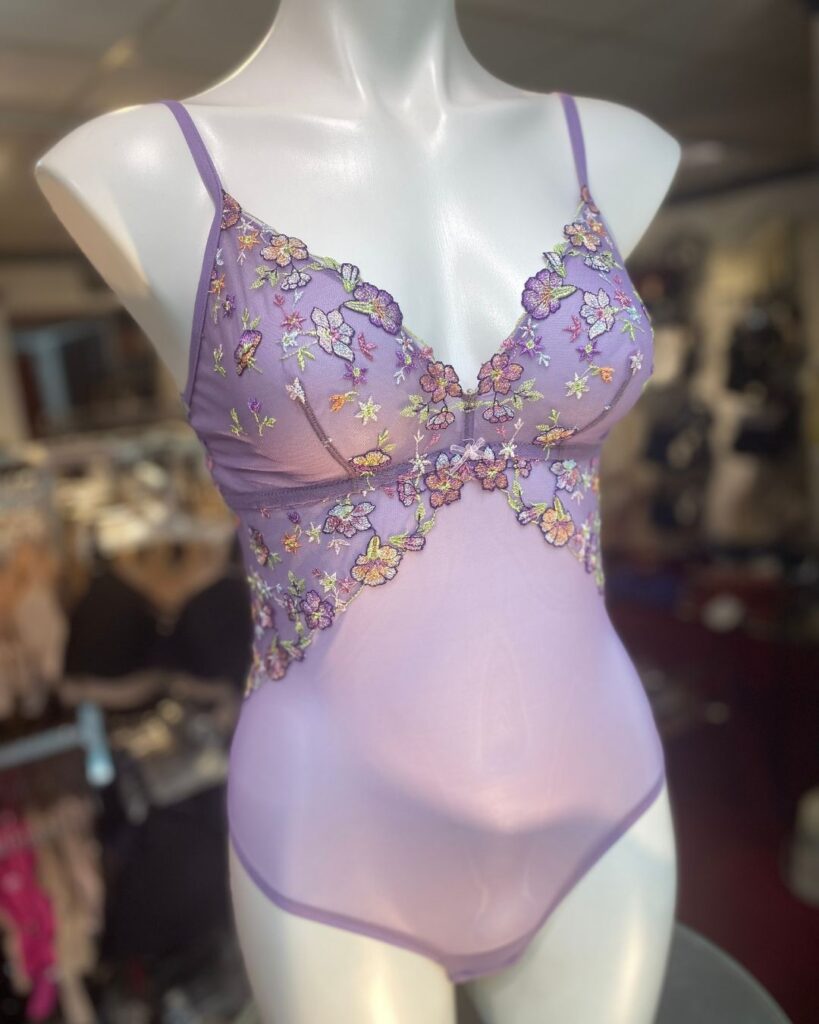 Lavender embroidered boudoir bodysuit displayed on a mannequin at Althea’s Fine Lingerie