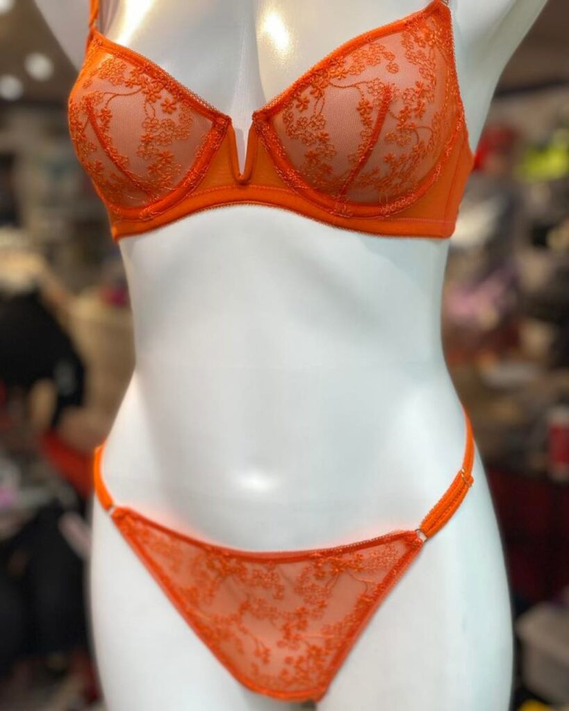 Orange lace boudoir lingerie set displayed on a mannequin at Althea’s Fine Lingerie in Milwaukee